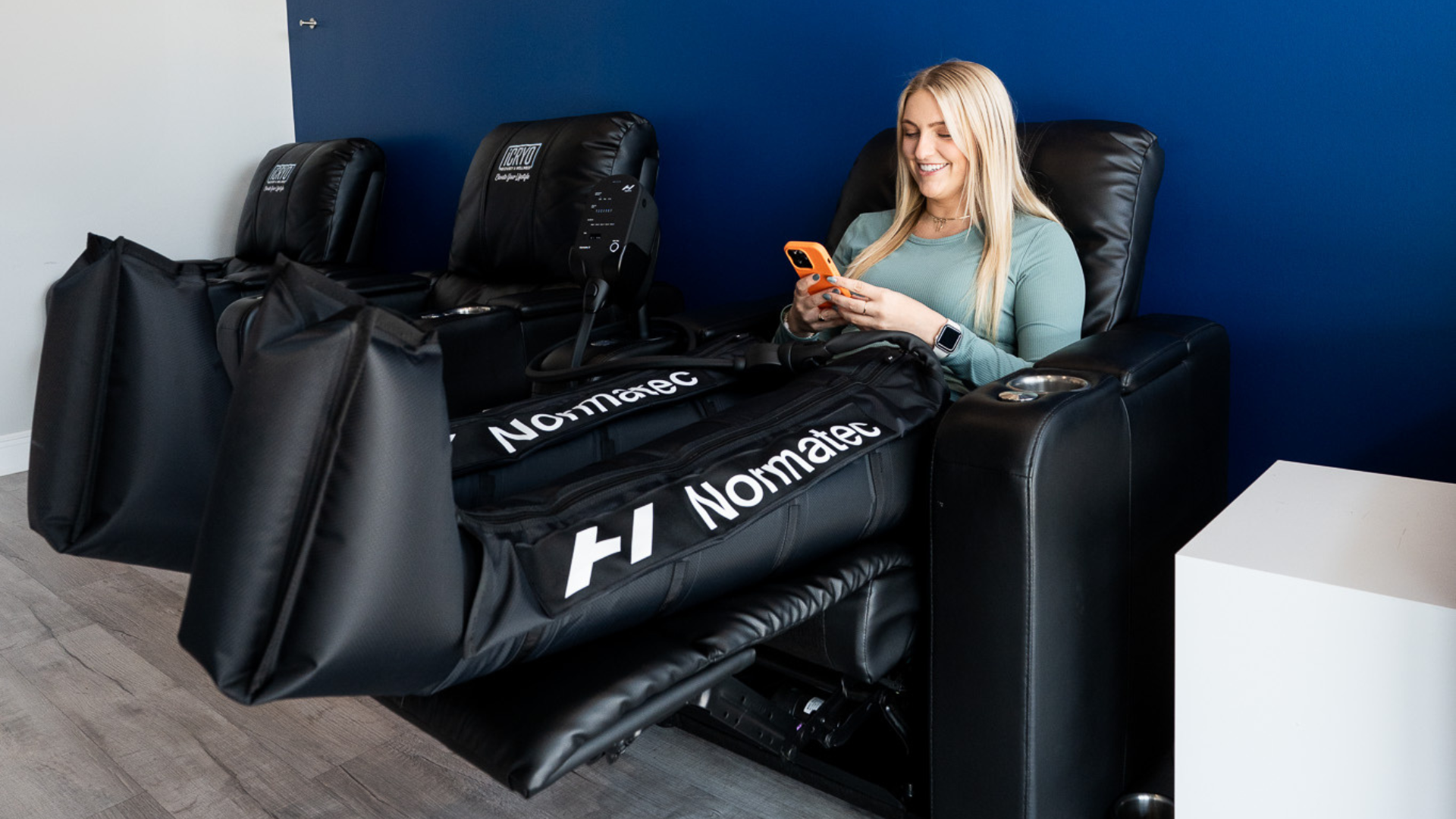 Athlete using compression therapy boots for muscle recovery and circulation