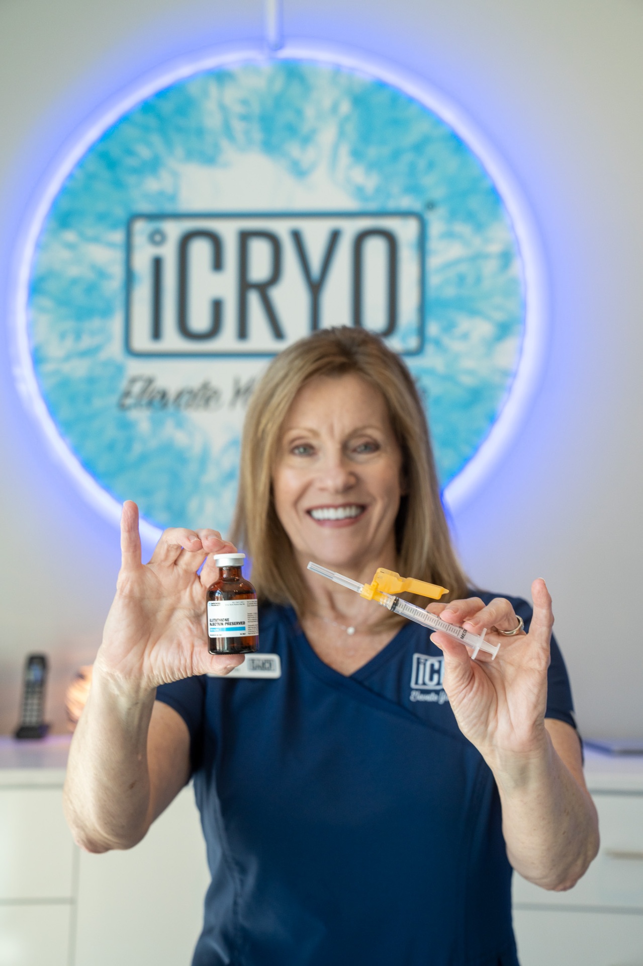iCRYO Daniel Island registered nurse holding glutathione IM shot vial and syringe
