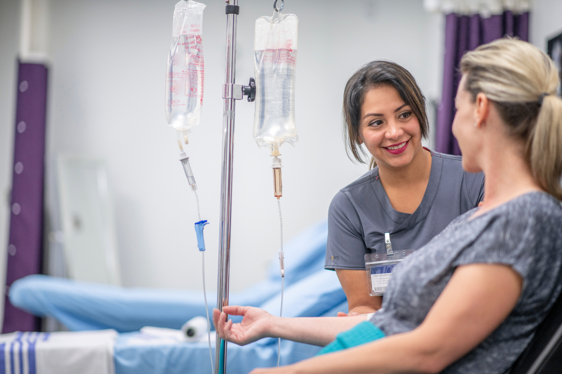 Registered Nurse with a guest during a stem cell IV infusion at iCRYO Daniel Island