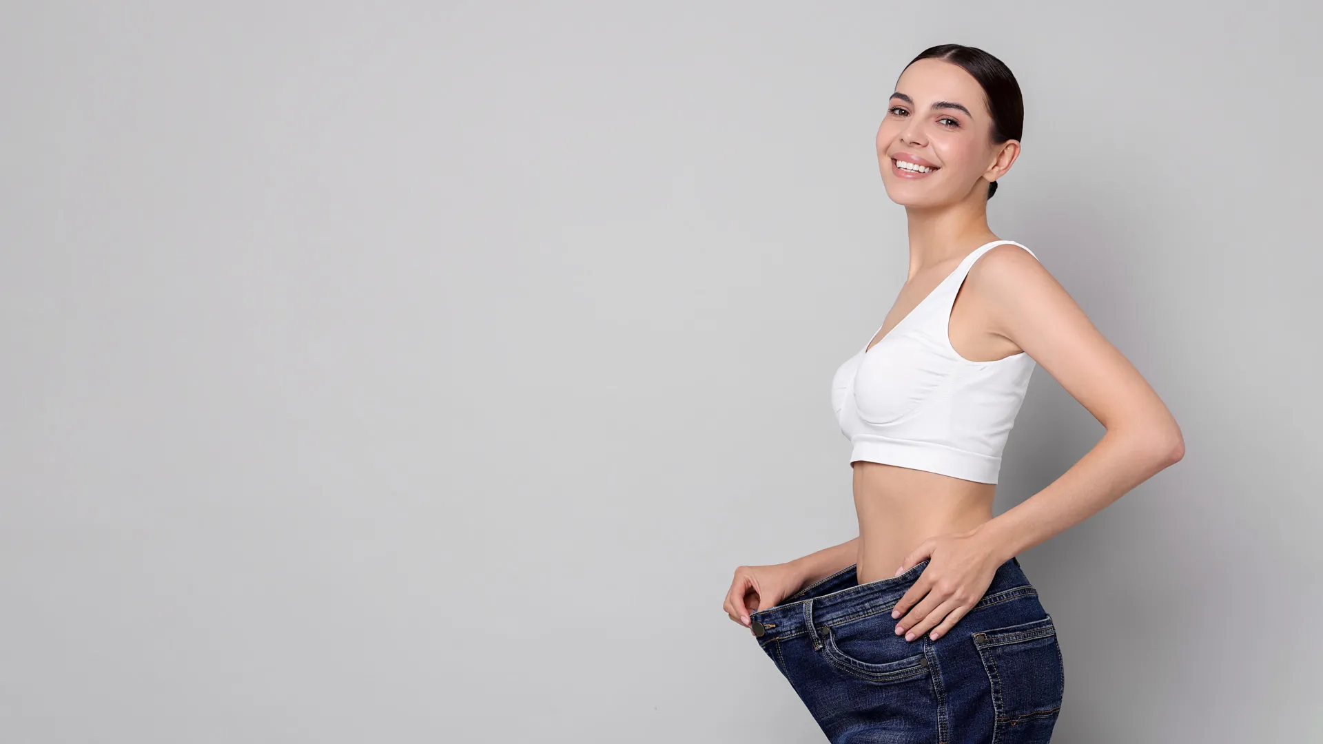 Woman celebrating weight loss results at iCRYO Daniel Island Medical Weight Loss program